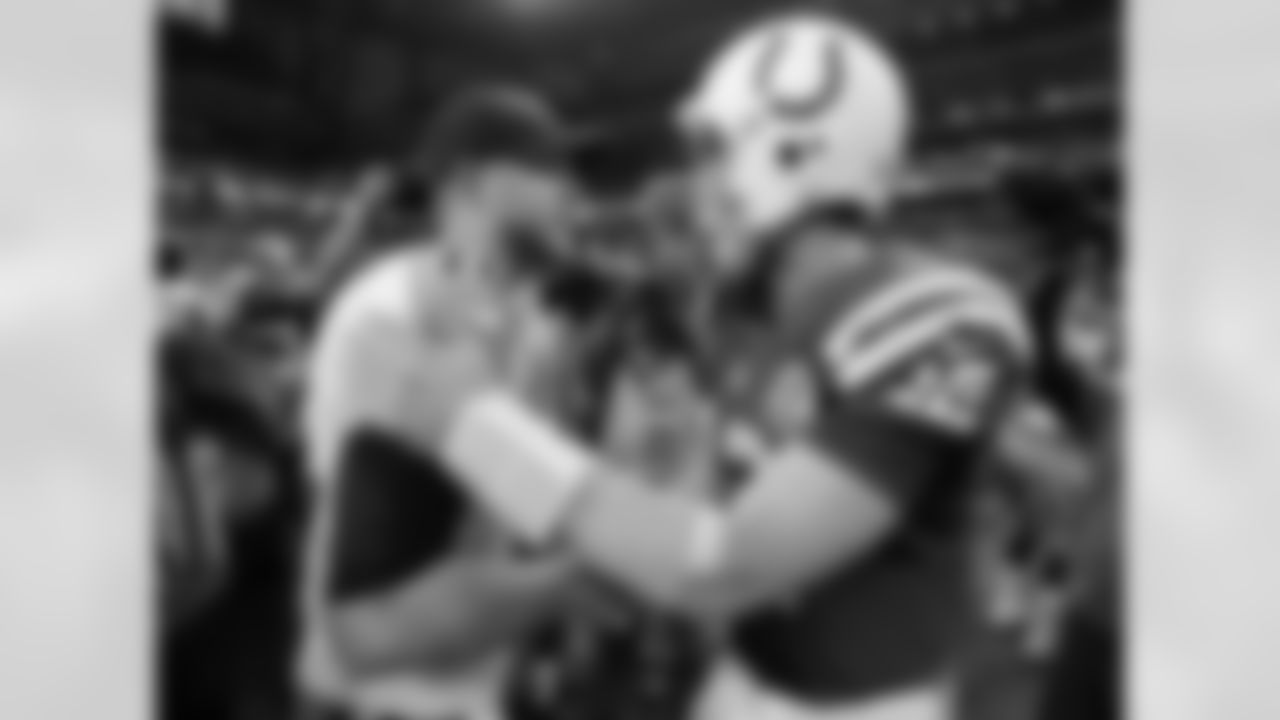 Indianapolis Colts quarterback Andrew Luck (12) is congratulated by Tennessee Titans quarterback Jake Locker (10) following an NFL football game, Sunday, Dec. 9, 2012, in Indianapolis. The Colts won 27-23. (AP Photo/Michael Conroy)