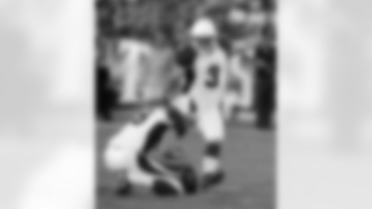 Arizona Cardinals kicker Jay Feely (3) boots a 49-yard field goal against the Tennessee Titans as Dave Zastudil (9) holds in the second quarter of an NFL football preseason game on Thursday, Aug. 23, 2012, in Nashville, Tenn. (AP Photo/Joe Howell)