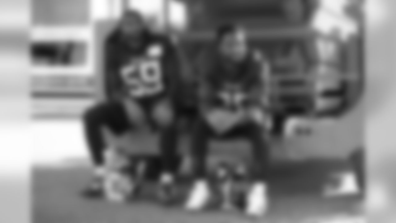 Tennessee Titans' linebacker Wesley Woodyard, left, and cornerback Logan Ryan react as they are photographed waiting their turn to give press conferences after an NFL training session at Syon House, in Syon Park, south west London, Friday, Oct. 19, 2018. The Tennessee Titans are preparing for an NFL regular season game against the Los Angeles Chargers in London on Sunday. (AP Photo/Matt Dunham)
