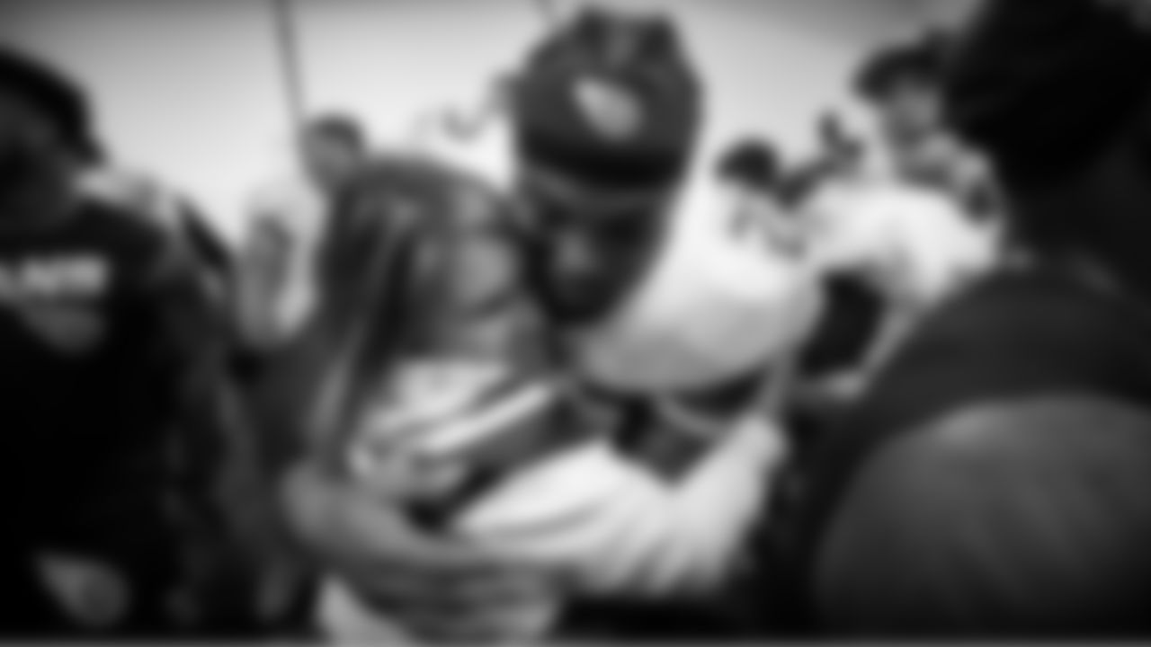BALTIMORE, MD - JANUARY 11, 2020 - Running back Derrick Henry #22 of the Tennessee Titans hugs Controlling Owner and Co-Chairman, Board of Directors Amy Adams Strunk in the locker room after the AFC Divisional Playoff Game between the Tennessee Titans and the Baltimore Ravens at M&T Bank Stadium in Baltimore, MD. Photo By Donald Page/Tennessee Titans