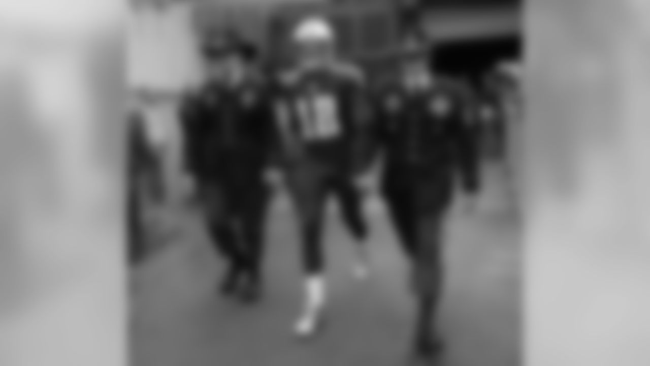 Soldiers walk onto the field with Tennessee Titans wide receiver Rishard Matthews (18) before an NFL football game against the Cincinnati Bengals Sunday, Nov. 12, 2017, in Nashville, Tenn. (AP Photo/James Kenney)