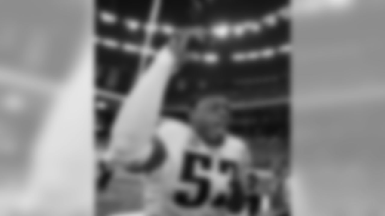 Tennessee Titans linebacker Keith Bulluck (53) celebrates the Titans 31-14 victory over the New Orleans Saints at the end of the game in the Louisiana Superdome in New Orleans, Monday, Sept. 24, 2007. Bulluck made three interceptions in the game. (AP Photo/Alex Brandon)