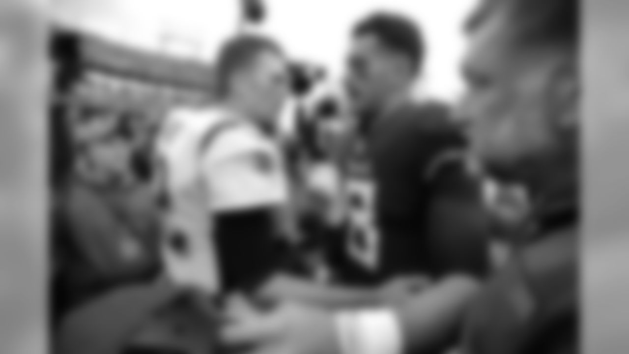 New England Patriots quarterback Tom Brady (12) congratulates Tennessee Titans quarterback Marcus Mariota (8) after an NFL football game Sunday, Nov. 11, 2018, in Nashville, Tenn. The Titans won 34-10. (AP Photo/Mark Zaleski)