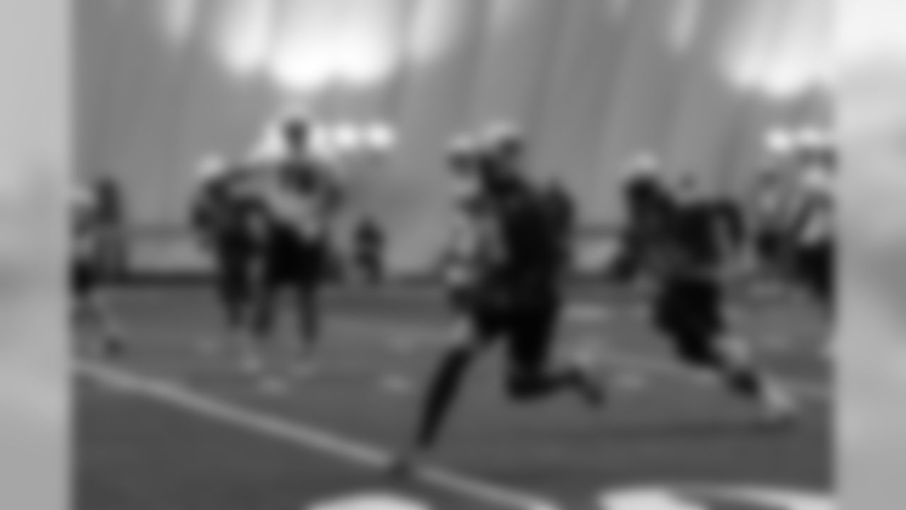 Titans players practice inside during Tuesday's organized training activity (OTA) at Baptist Sports Park in Nashville, Tenn.