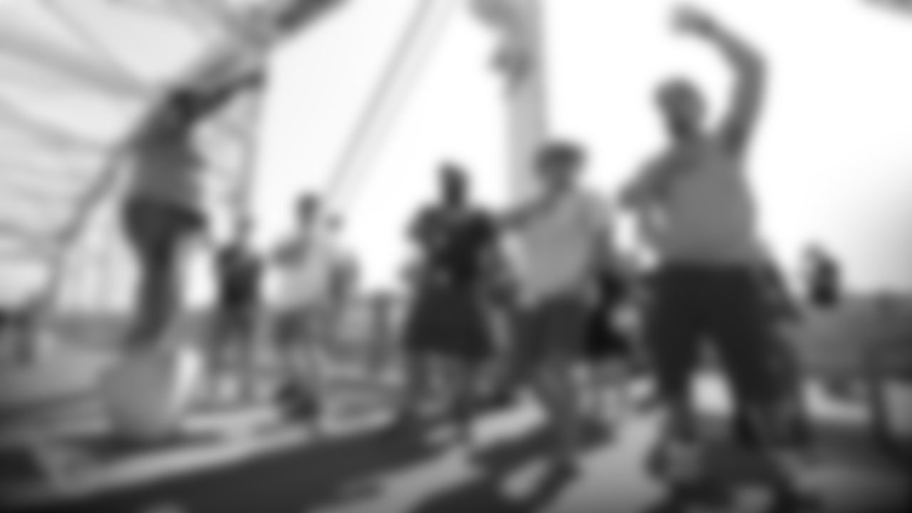 NASHVILLE, TN - SEPTEMBER 15, 2019 - Fans chant on the pedestrian bridge outside Nissan Stadium as they gather fans for the Titans March before the game between the Tennessee Titans and the Indianapolis Colts in Nashville, TN. Photo By Kelly Donoho/Tennessee Titans