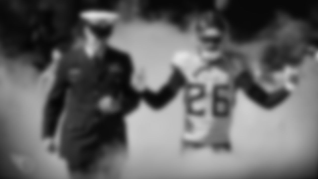 NASHVILLE, TN - NOVEMBER 10, 2019 - Cornerback Logan Ryan #26 of the Tennessee Titans running through the smoke with Service Member during introductions before the game between the Tennessee Titans and the Kansas City Chiefs at Nissan Stadium in Nashville, TN. Photo By Kayla Schoen/Tennessee Titans