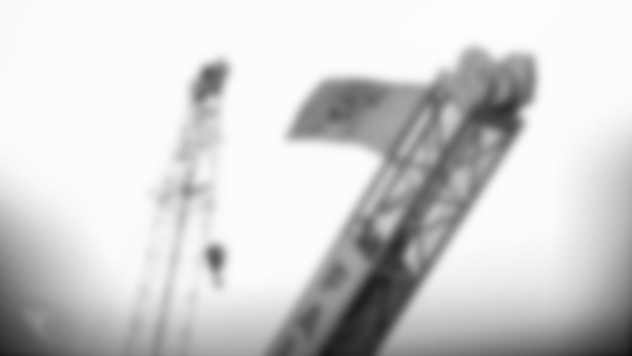 NASHVILLE, TN - JANUARY 17, 2020 - Construction worker hangs a Tennessee Titans flag on a piece of equipment during practice at Saint Thomas Sports Park in Nashville, TN. Photo By Donald Page/Tennessee Titans