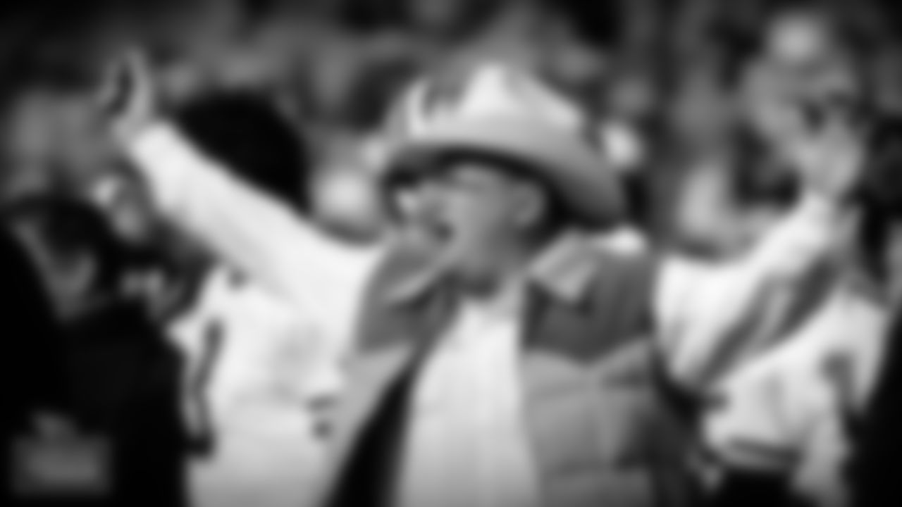Phillips was the personification of the 'Luv Ya Blue Era' as the head coach of the Oilers for six seasons (1975-80). He owns the best winning percentage (.608) by a Titans/Oilers head coach who has coached at least two full seasons, totaling a 59-38 mark. He took over a team that hadn't experienced a winning season in eight campaigns and built it into a contender for the duration of his tenure, going 10-4 in his first season and reaching the AFC Championship game in 1978 and 1979. (AP Photo/Greg Trott)