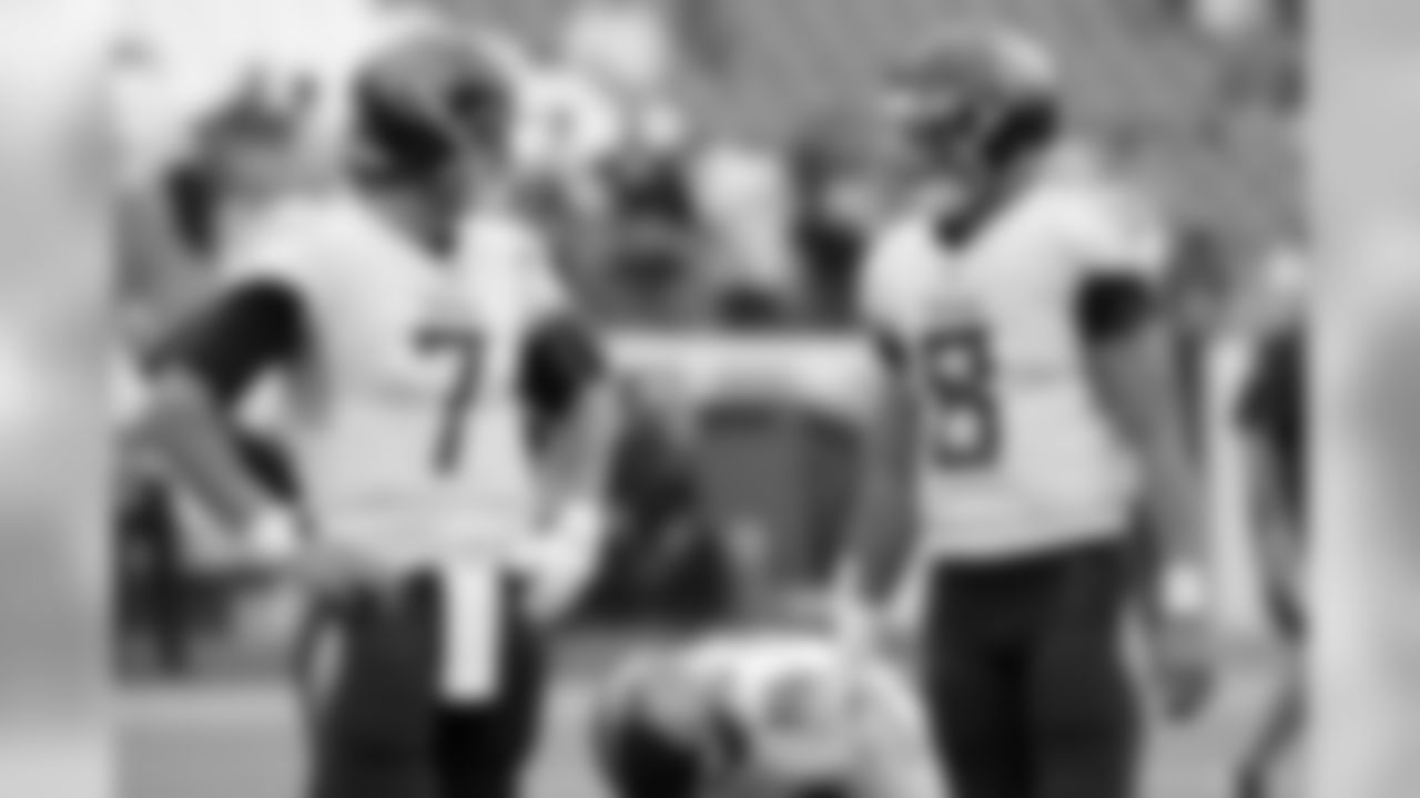 Tennessee Titans quarterbacks Blaine Gabbert (7) and Marcus Mariota (8) talk before an NFL football game against the Houston Texans Sunday, Sept. 16, 2018, in Nashville, Tenn. (AP Photo/Mark Zaleski)