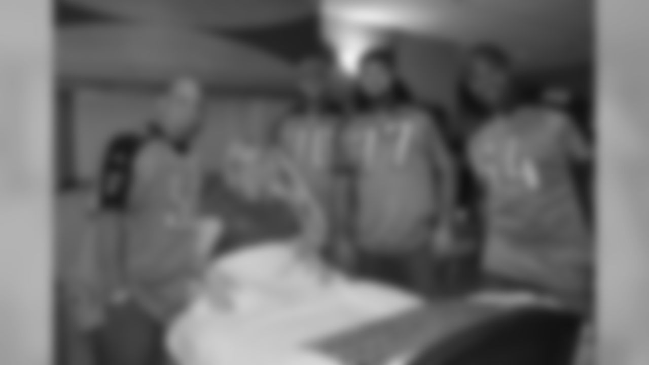 Offensive linemen Troy Kropog (70), Ryand Durand (77), Leroy Harris (64), Eugene Amano (54) and Fernando Velaso (61) visit with patients at Baptist Hospital during their day off from football on Tuesday, Oct. 10, 2009 in Nashville, Tenn.
