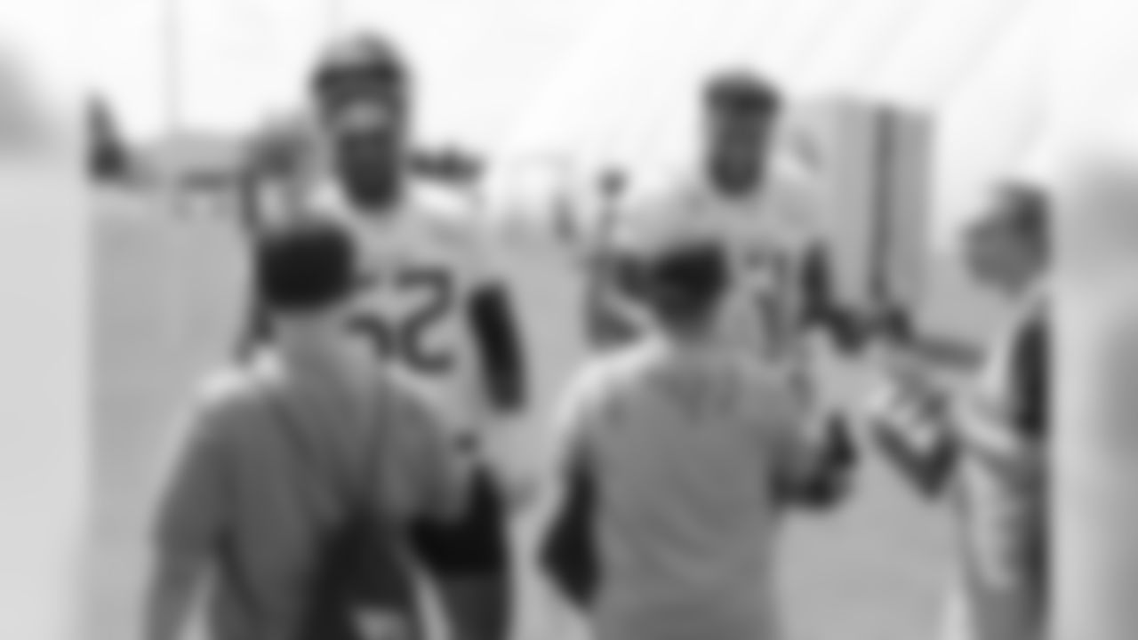 NASHVILLE, TN - AUGUST 21, 2019 - Center/guard Hroniss Grasu #52 of the Tennessee Titans and Guard Aaron Stinnie #61 of the Tennessee Titans with special guests from the Special Olympics during practice at Saint Thomas Sports Park in Nashville, TN. Photo By Donald Page/Tennessee Titans