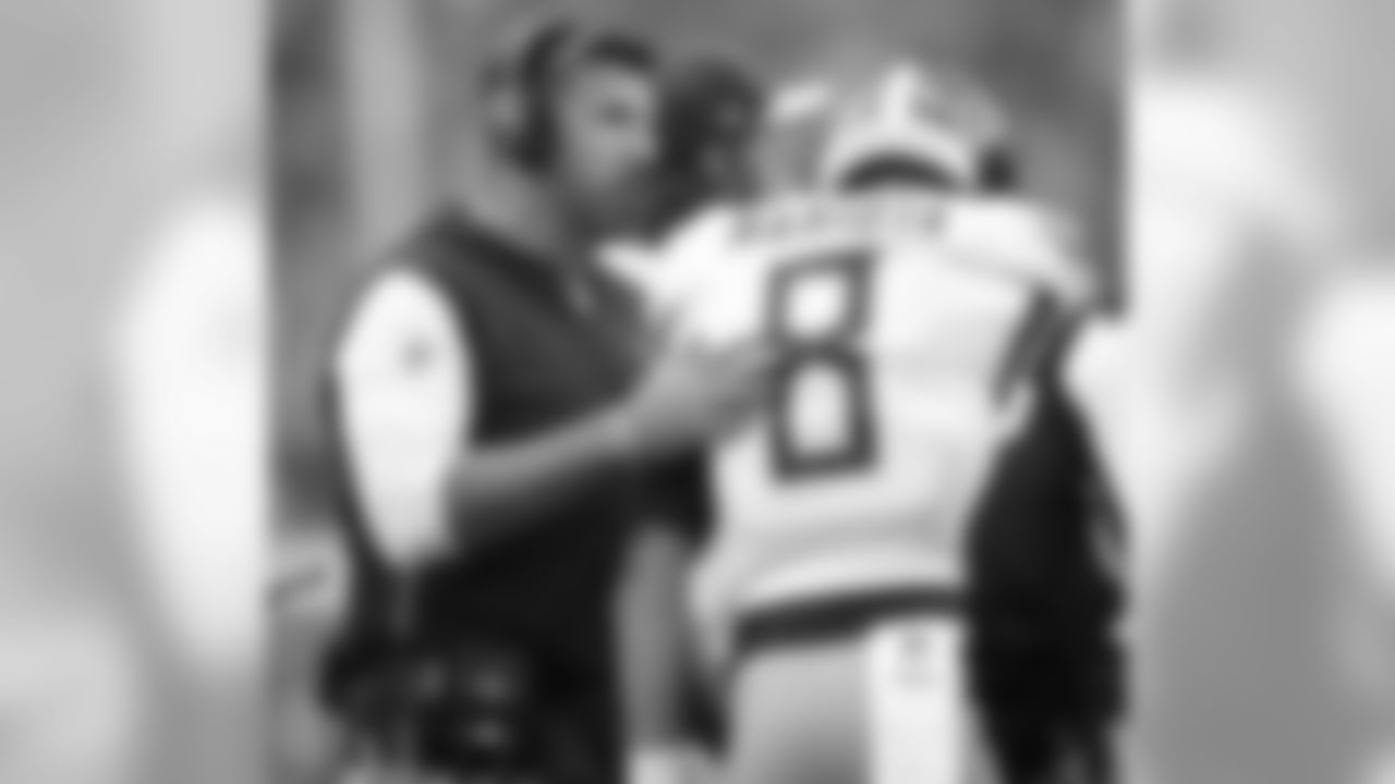 Tennessee Titans head coach Mike Vrabel, left, talks to quarterback Marcus Mariota during the first half of an NFL football game against the Buffalo Bills, Sunday, Oct. 7, 2018, in Orchard Park, N.Y. (AP Photo/Adrian Kraus)