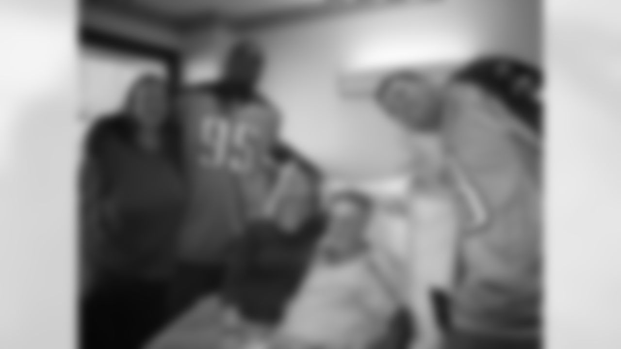 Titans players Craig Stevens (88), Jason Jones (91), William Hayes (95) and Ken Amato (58) visit patients at Saint Thomas Hospital on Tuesday, Nov. 3, 2009 in Nashville, Tenn.