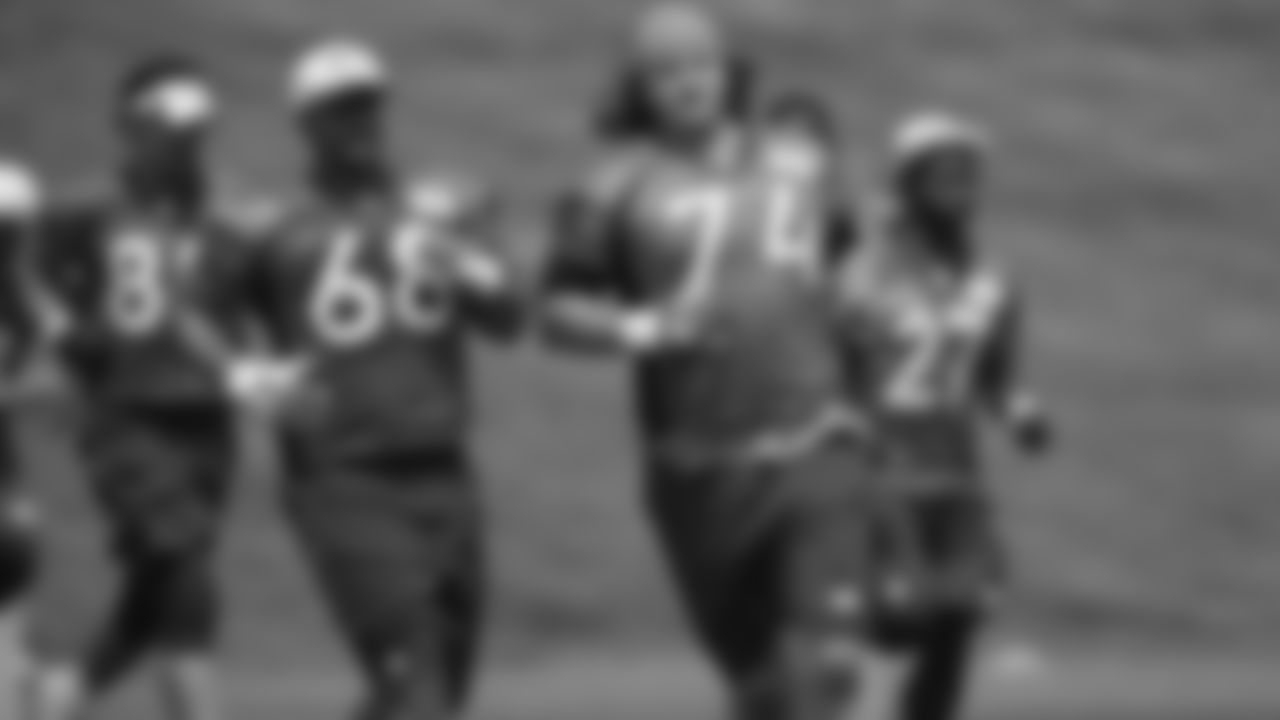Denver Broncos rookie offensive lineman Ty Sambrailo, front, and tackle Ryan Harris run during a mandatory minicamp session for the NFL team Tuesday, June 9, 2015, in Englewood, Colo. (AP Photo/David Zalubowski)