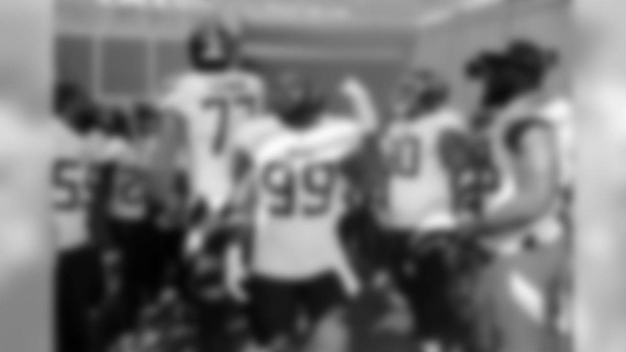 Tennessee Titans players including Taylor Lewan (77) and Jurrell Casey (99) get ready to take the field before an NFL football game against the Philadelphia Eagles Sunday, Sept. 30, 2018, in Nashville, Tenn. (AP Photo/James Kenney)