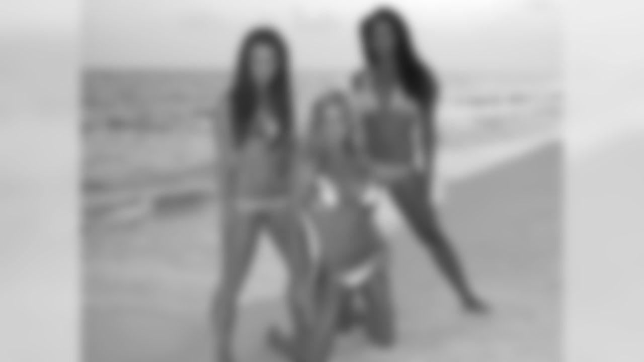 Tennessee Titans cheerleaders take part in a sunset photo shoot Tuesday afternoon at the Sandestin Golf and Beach Resort.
