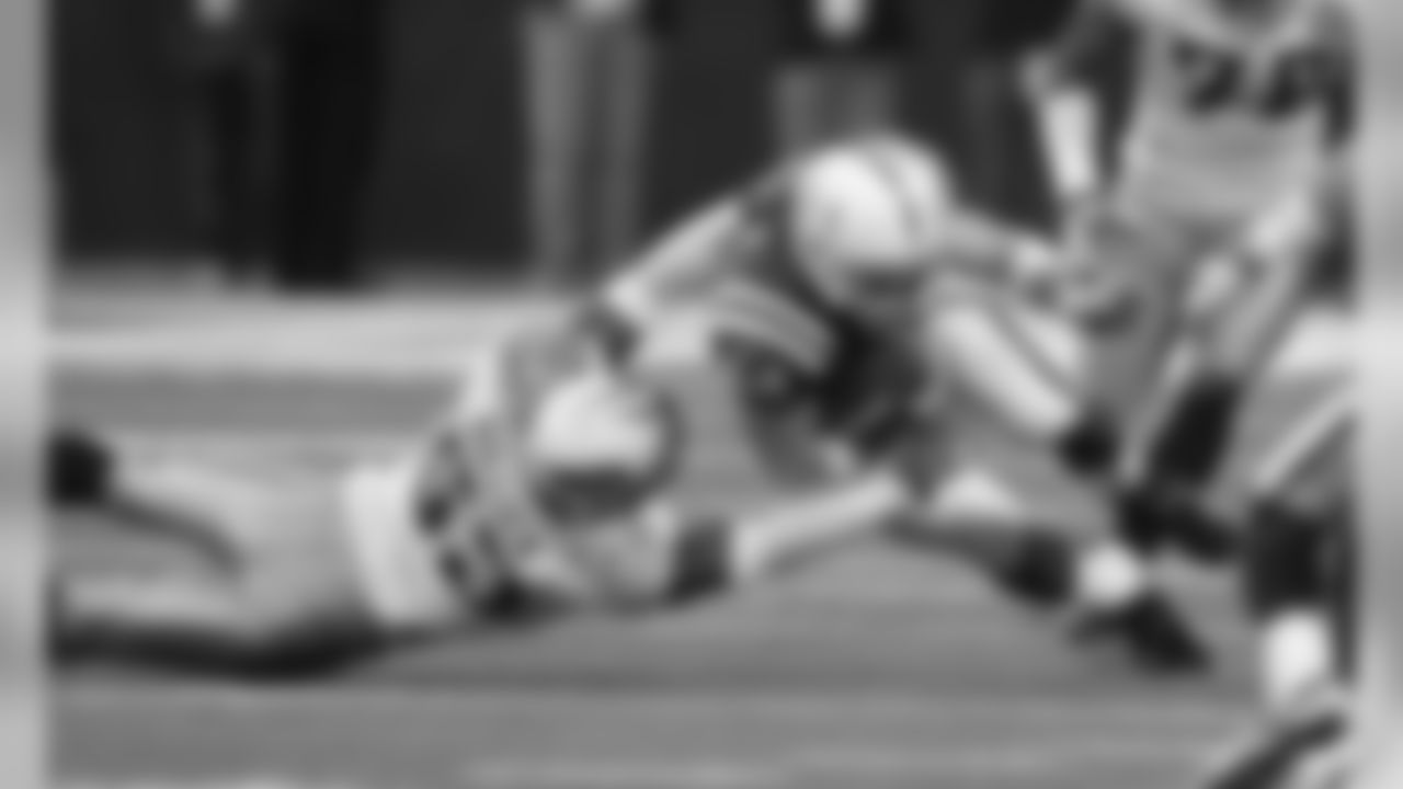 Indianapolis Colts tight end Dallas Clark (44) is tackled by Tennessee Titans linebacker Keith Bulluck during
an NFL football game in Indianapolis, Sunday, Dec. 6, 2009. Indianapolis won 27-17. (AP Photo/Darron Cummings)