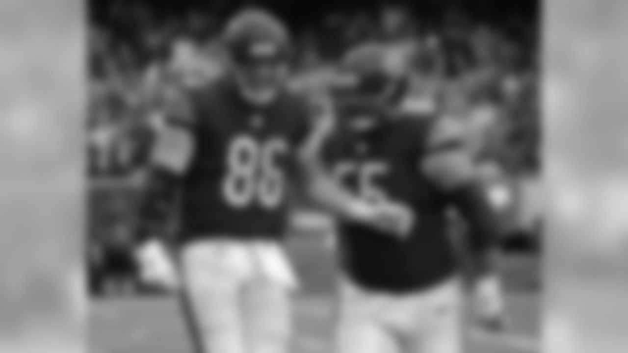 Chicago Bears tight end Zach Miller (86) celebrates a touchdown with center Hroniss Grasu (55) during the second half of an NFL football game against the Washington Redskins, Sunday, Dec. 13, 2015, in Chicago. (AP Photo/Nam Y. Huh)