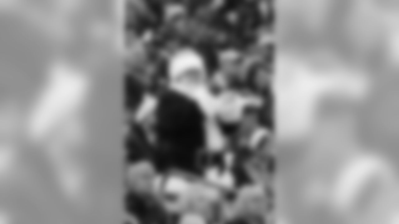 A Tennessee Titans fan dressed as Santa Claus watches in the first quarter of an NFL football game against the St. Louis Rams on Sunday, Dec. 13, 2009 in Nashville, Tenn. (AP Photo/Wade Payne)