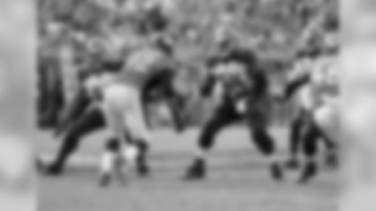 Tampa Bay Buccaneers offensive lineman Evan Smith (62) and guard Kevin Pamphile (64) set to block against the Denver Broncos in a week four NFL football game in Tampa, Fla. Denver won 27 - 7. (Al Messerschmidt via AP)