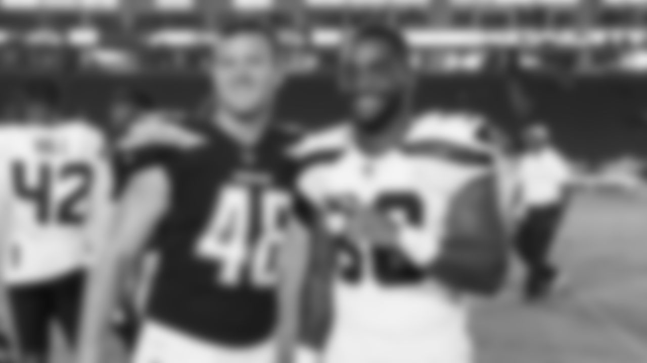 Los Angeles Chargers linebacker Nick Dzubnar (48) and Seattle Seahawks defensive back Bradley McDougald (30) poses for a photo after an NFL preseason football game on Saturday, Aug. 18, 2018 in Carson, Calif. The Chargers won, 24-14. (Ric Tapia via AP)