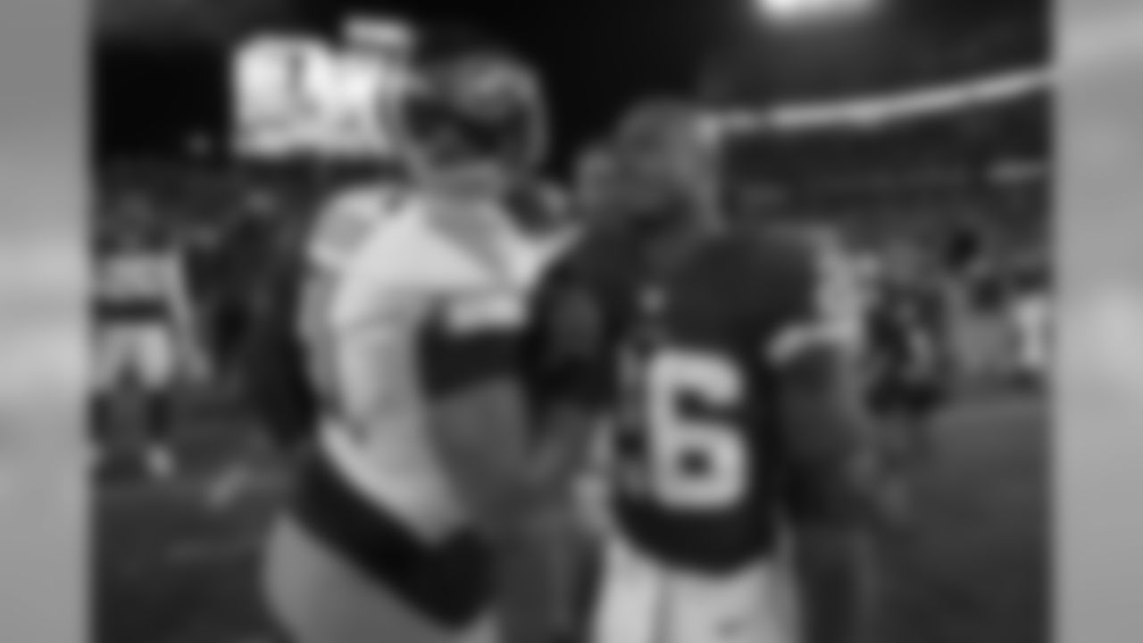 Tennessee Titans outside linebacker Derrick Morgan (91) greets Washington Redskins running back Adrian Peterson (26) after an NFL football game, Saturday, Dec. 22, 2018 in Nashville, TN. (Aaron Doster via AP)