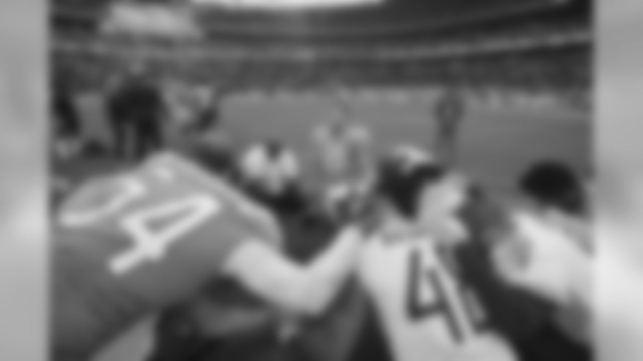 Los Angeles Chargers quarterback Philip Rivers (17), center, joins other players in prayer after an NFL football game against Tennessee Titans at Wembley stadium in London, Sunday, Oct. 21, 2018. Los Angeles Chargers won the match 20-19. (AP Photo/Tim Ireland)