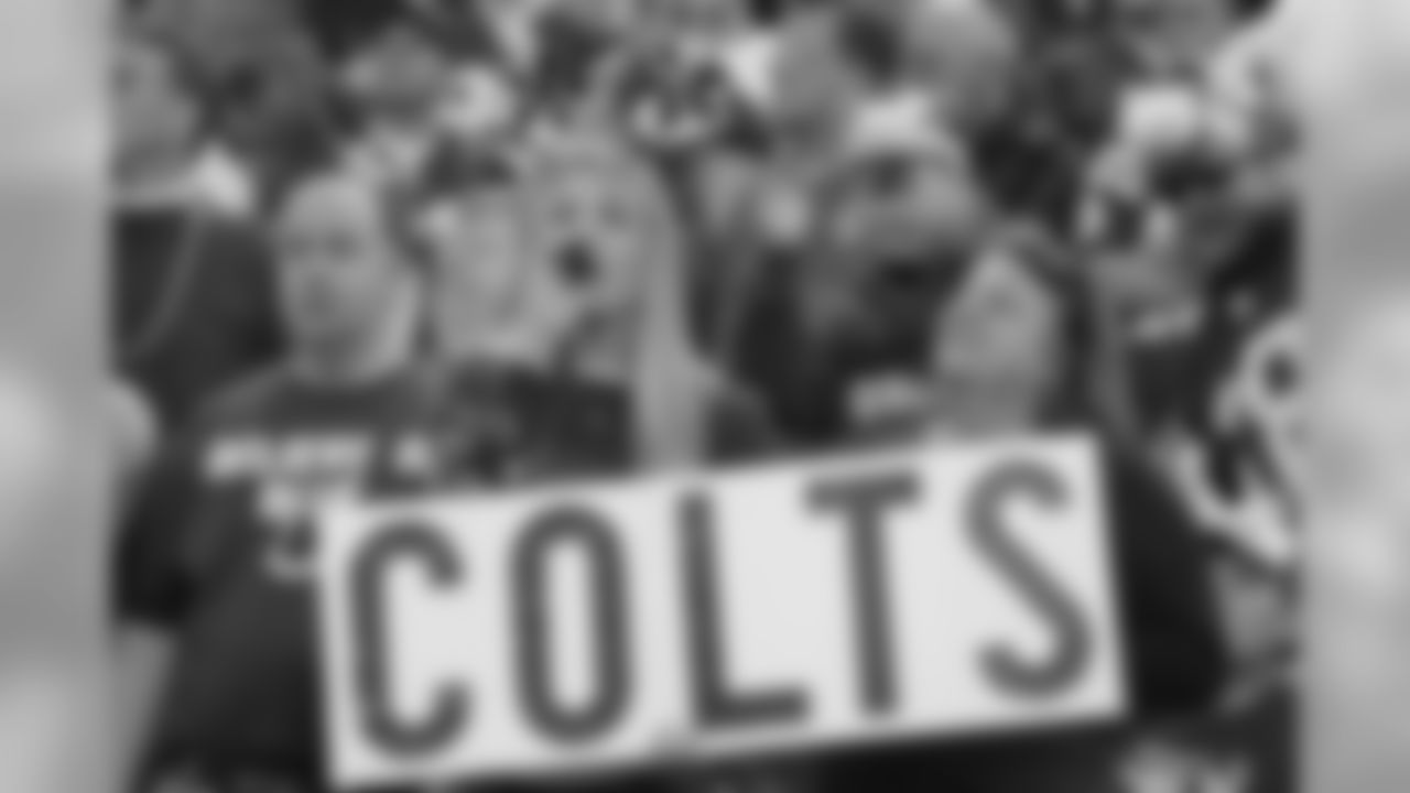 Indianapolis Colts fans cheer as the Colts played the Tennessee Titans in the first quarter of an NFL football game in Indianapolis, Sunday, Dec. 6, 2009. (AP Photo/Michael Conroy)