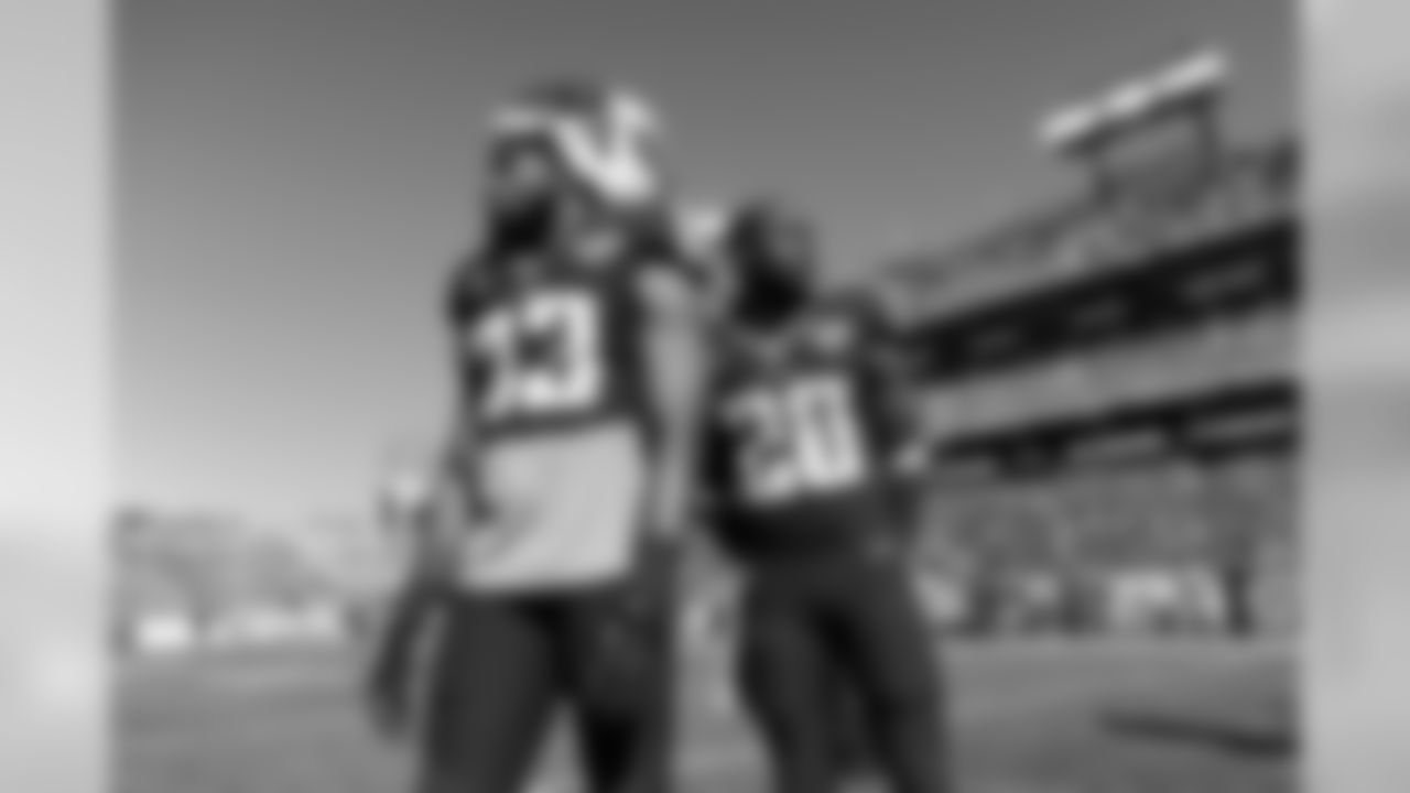 Tennessee Titans safety Michael Griffin (33) and cornerback Alterraun Verner (20) stand on the field before an NFL football game between the Titans and the Jacksonville Jaguars on Sunday, Nov. 10, 2013, in Nashville, Tenn. (AP Photo/Mark Zaleski)
