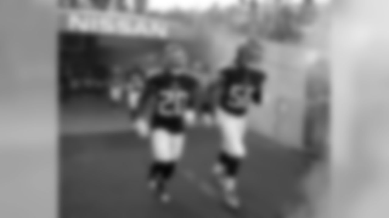 Tennessee Titans defensive back Demontre Hurst (20) and linebacker Sharif Finch (56) take the field before a preseason NFL football game against the Tampa Bay Buccaneers Saturday, Aug. 18, 2018, in Nashville, Tenn. (AP Photo/James Kenney)