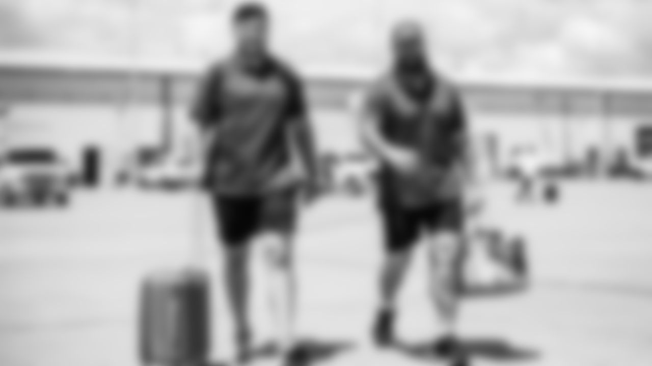 Offensive lineman Dillon Radunz #75 of the Tennessee Titans and Guard Jordan Roos #70 of the Tennessee Titans during the travel day at the Nashville International Airport on August 15, 2023 in Nashville, TN. Photo by Donald Page/Tennessee Titans