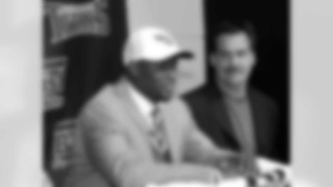 Former Texas quarterback Vince Young who was the third pick overall in the first round of the NFL Draft by the Tennessee Titans is pictured in Nashville, Tenn., with Titans head coach Jeff Fisher during his introduction to the media on Saturday April 29, 2006. (AP Photo/Neil Brake)