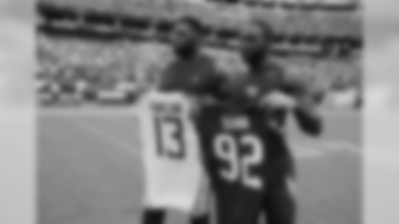 Houston Texans defensive tackle Brandon Dunn, left, trades jerseys with Tennessee Titans wide receiver Taywan Taylor, right, after an NFL football game Sunday, Sept. 16, 2018, in Nashville, Tenn. The Titans won 20-17. (AP Photo/James Kenney)