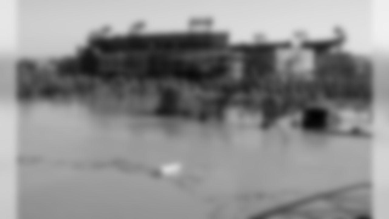 Debris floats by on a rain-swollen Cumberland River in downtown Nashville, Tenn., near LP Field, on Monday, May 3, 2010. The Cumberland River continues to rise at Nashville, but is nearing its crest. Floodwater has spilled onto a couple of downtown streets near the riverfront and restaurants and bars in the tourist district are closed. (AP Photo/Kristin M. Hall )