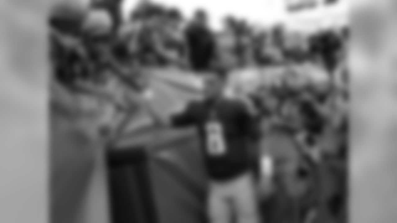 Tennessee Titans quarterback Marcus Mariota (8) slaps hands with fans after an NFL football game against the Baltimore Ravens Sunday, Nov. 5, 2017, in Nashville, Tenn. The Titans won 23-20. (AP Photo/James Kenney)