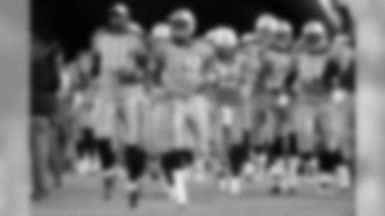 Tennessee Titans players, including quarterback Vince Young (10) and tight end Jared Cook (89), take the field before an NFL football game against the Indianapolis Colts in Nashville, Tenn., Sunday, Oct. 11, 2009. (AP Photo/John Russell)