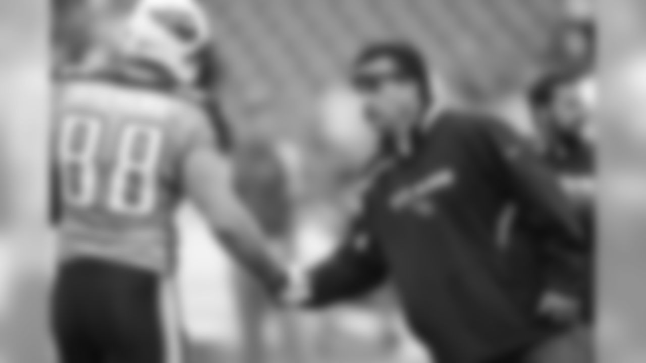 Tennessee Titans head coach Jeff Fisher greets tight end Craig Stevens (88) before the start of an NFL football game on Sunday, Nov. 29, 2009 in Nashville, Tenn. (AP Photo/Wade Payne)