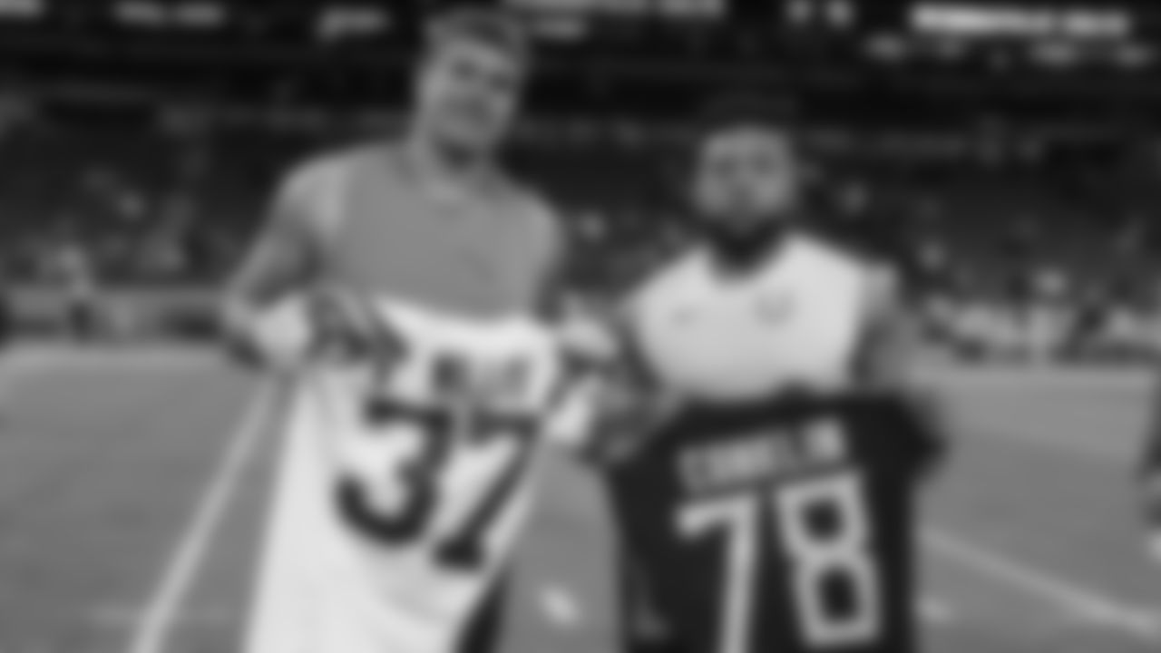 Indianapolis Colts safety Khari Willis (37) and Tennessee Titans offensive tackle Jack Conklin (78) exchange jerseys following an NFL football game in Indianapolis, Sunday, Dec. 1, 2019. The Titans defeated the Colts 31-17. (AP Photo/Darron Cummings)
