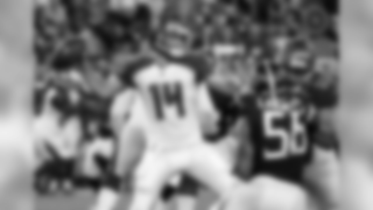 Tampa Bay Buccaneers quarterback Ryan Fitzpatrick (14) passes as offensive tackle Brad Seaton (60) blocks Tennessee Titans linebacker Harold Landry (58) in the first half of a preseason NFL football game Saturday, Aug. 18, 2018, in Nashville, Tenn. (AP Photo/James Kenney)