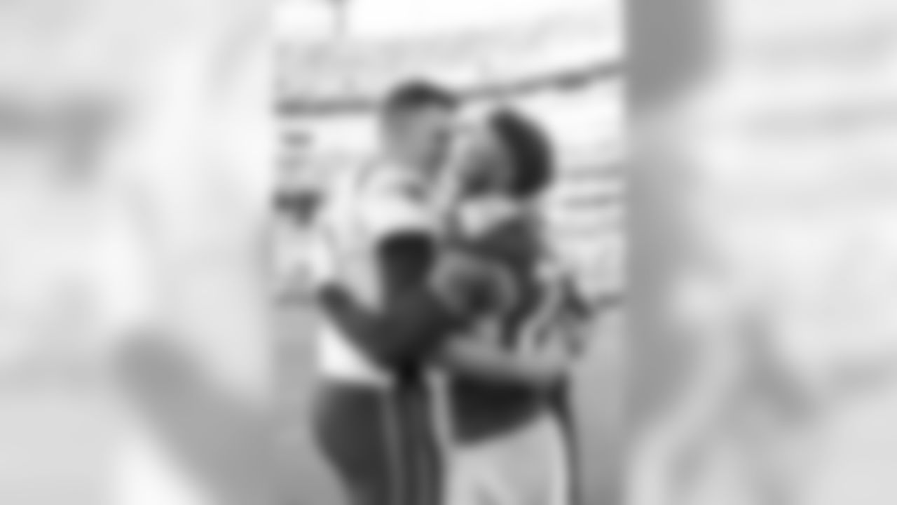 NASHVILLE, TN - AUGUST 17, 2019 - Cornerback Logan Ryan #26 of Tennessee Titans and Quarterback Tom Brady #12 of the New England Patriots share a hug before the preseason home game between the New England Patriots and the Tennessee Titans at Nissan Stadium in Nashville, TN. Photo By Kayla Schoen/Tennessee Titans