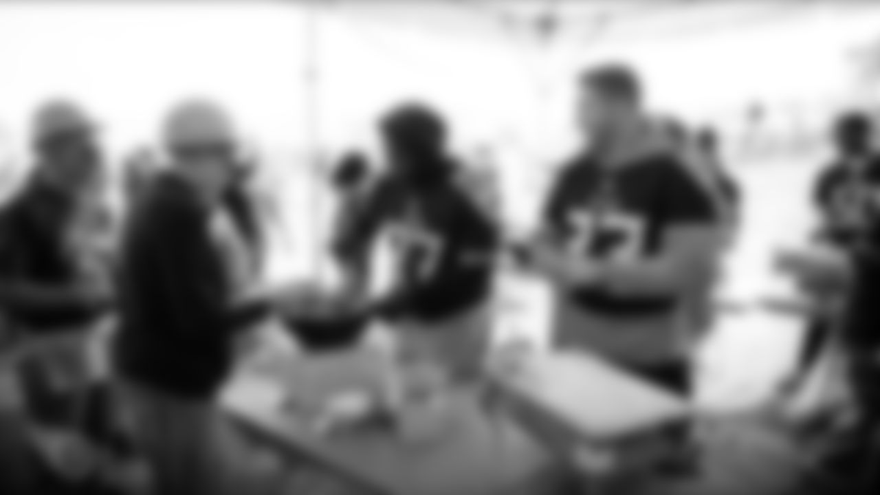 NASHVILLE, TN - OCTOBER 08, 2019 - Defensive tackle Isaiah Mack #97 of the Tennessee Titans and Tight end Parker Hesse #83 of the Tennessee Titans serving lunch for volunteers at a Jimmy & Rosalynn Carter Work Project and Habitat for Humanity build site in Nashville, TN. Photo By Donald Page/Tennessee Titans