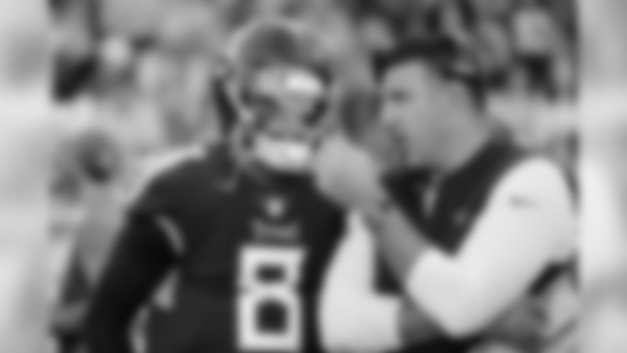 Tennessee Titans head coach Mike Vrabel talks with quarterback Marcus Mariota (8) before an NFL football game against the New York Jets Sunday, Dec. 2, 2018, in Nashville, Tenn. (AP Photo/James Kenney)