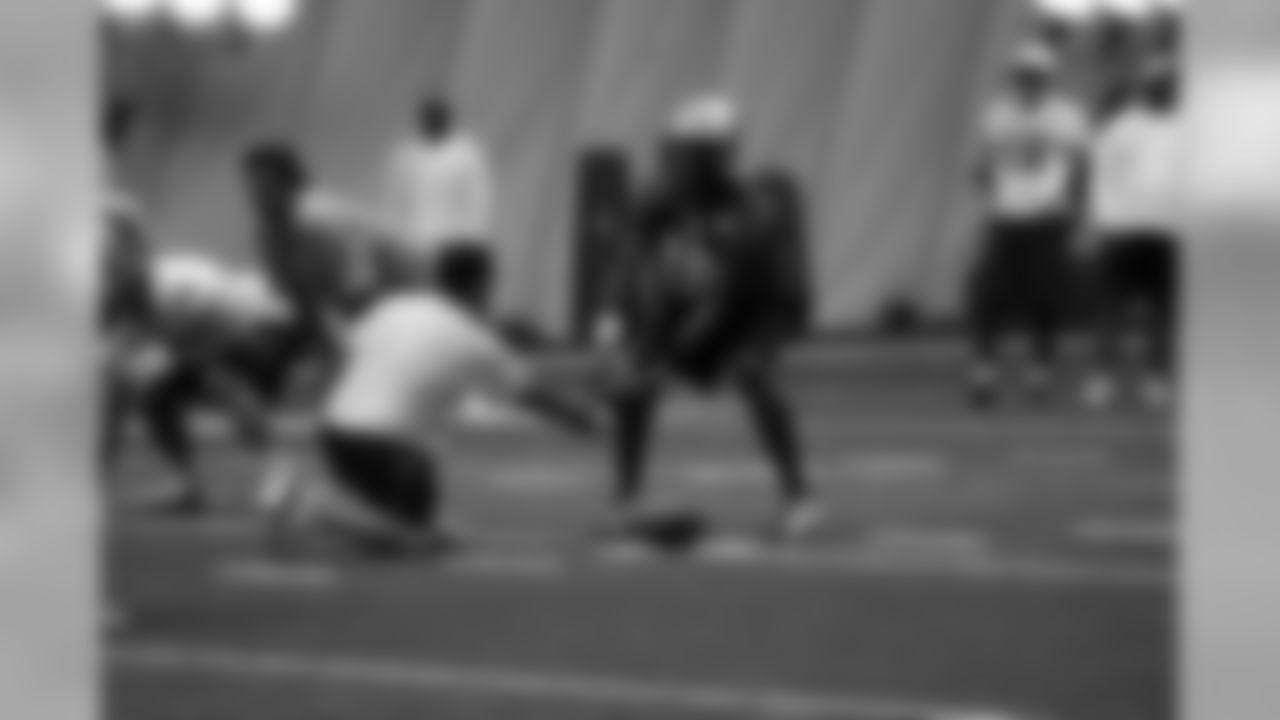 Titans players practice inside during Tuesday's organized training activity (OTA) at Baptist Sports Park in Nashville, Tenn.