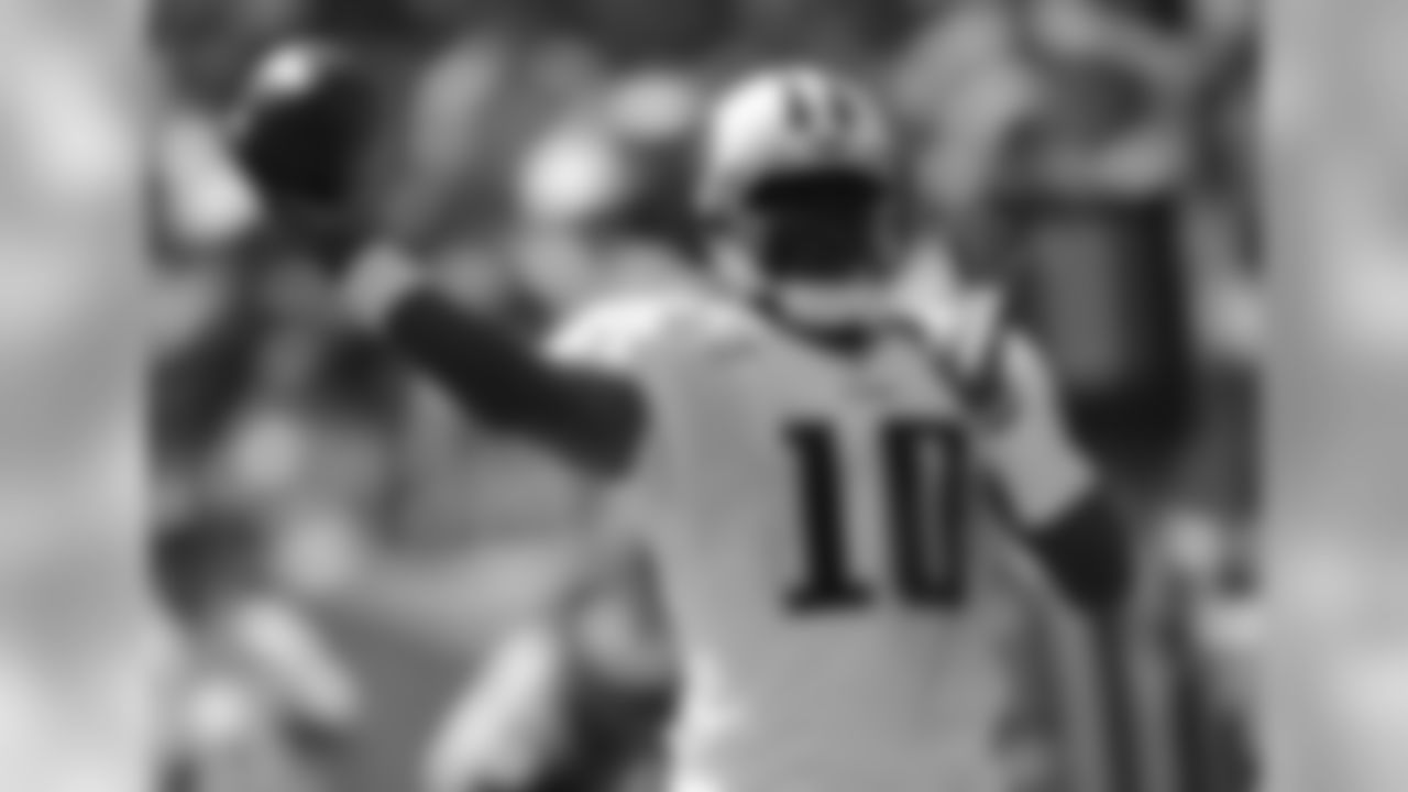 Tennessee Titans quarterback Vince Young passes against the Pittsburgh Steelers in the second quarter of an NFL football game on Sunday, Sept. 19, 2010, in Nashville, Tenn. (AP Photo/John Russell)