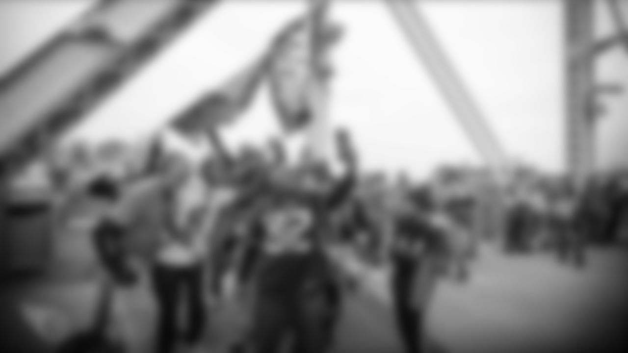 NASHVILLE, TN - DECEMBER 15, 2019 - Fans gather and walk across the pedestrian bridge during the Fan Walk before the game between the Tennessee Titans and the Houston Texans at Nissan Stadium in Nashville, TN. Photo By Brad Moore/Tennessee Titans