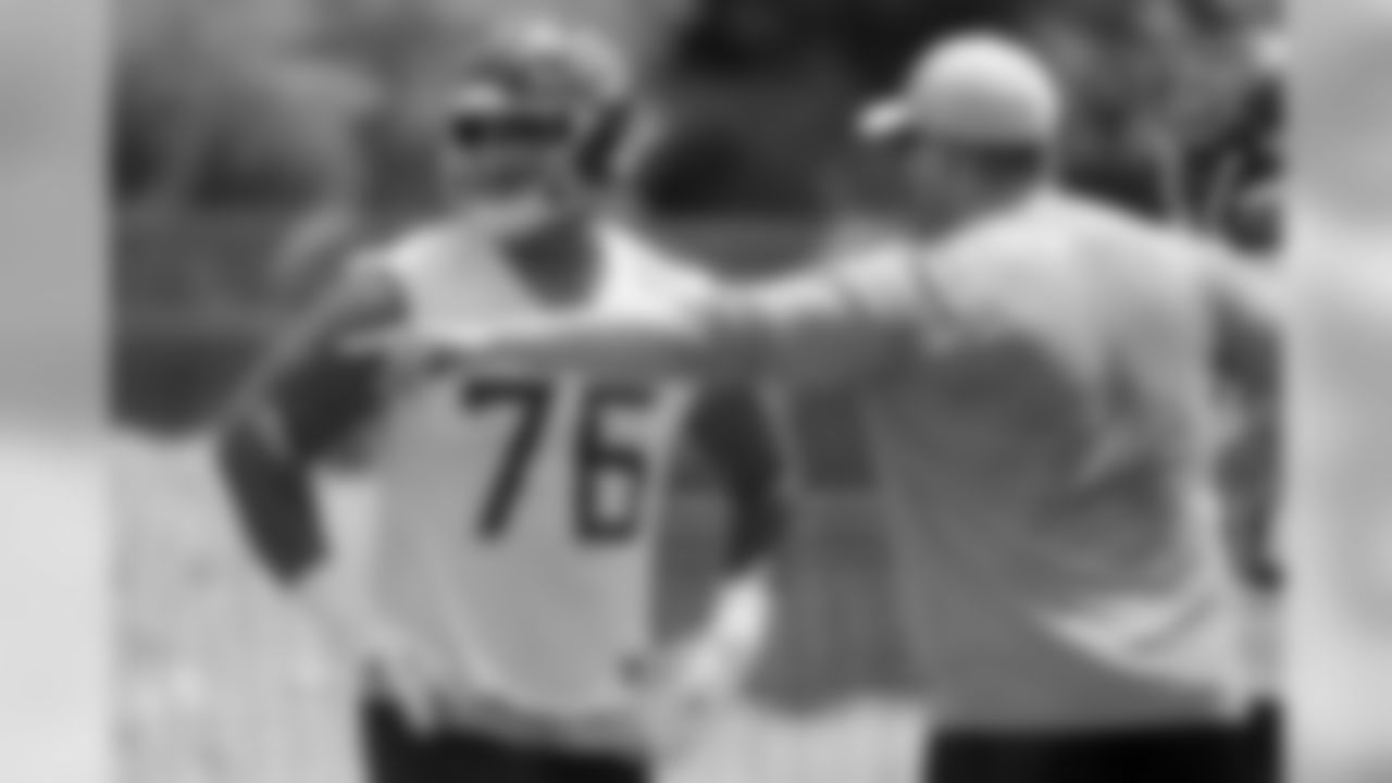 Tennessee Titans offensive guard Rodger Saffold (76) receives instruction during an organized team activity at the Titans' NFL football training facility Tuesday, May 21, 2019, in Nashville, Tenn. (AP Photo/Mark Humphrey)