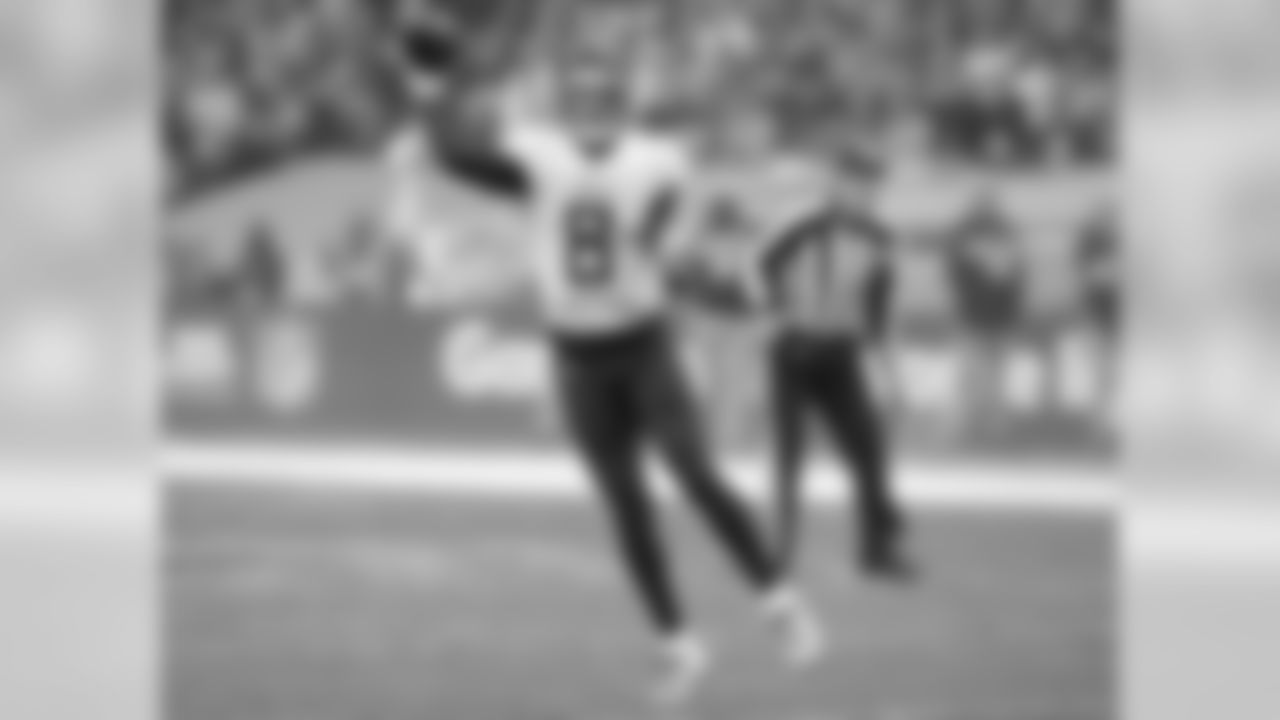 Tennessee Titans quarterback Marcus Mariota (8) passes the ball during the first half of an NFL football game against Los Angeles Chargers at Wembley stadium in London, Sunday, Oct. 21, 2018. (AP Photo/Matt Dunham)