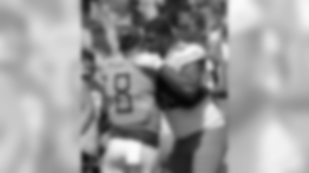 Jacksonville Jaguars defensive tackle Calais Campbell, right, greets Tennessee Titans quarterback Marcus Mariota (8) before the coin toss before an NFL football game, Sunday, Sept. 23, 2018, in Jacksonville, Fla. (AP Photo/John Raoux)