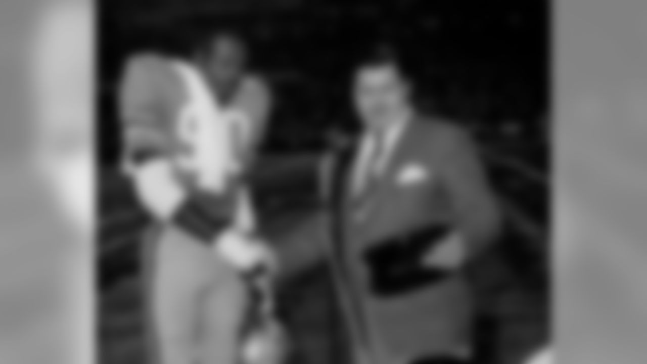 Mr. Adams with George Webster, who was drafted with the fifth spot in 1967, the first year a common draft was held between the AFL and NFL.
