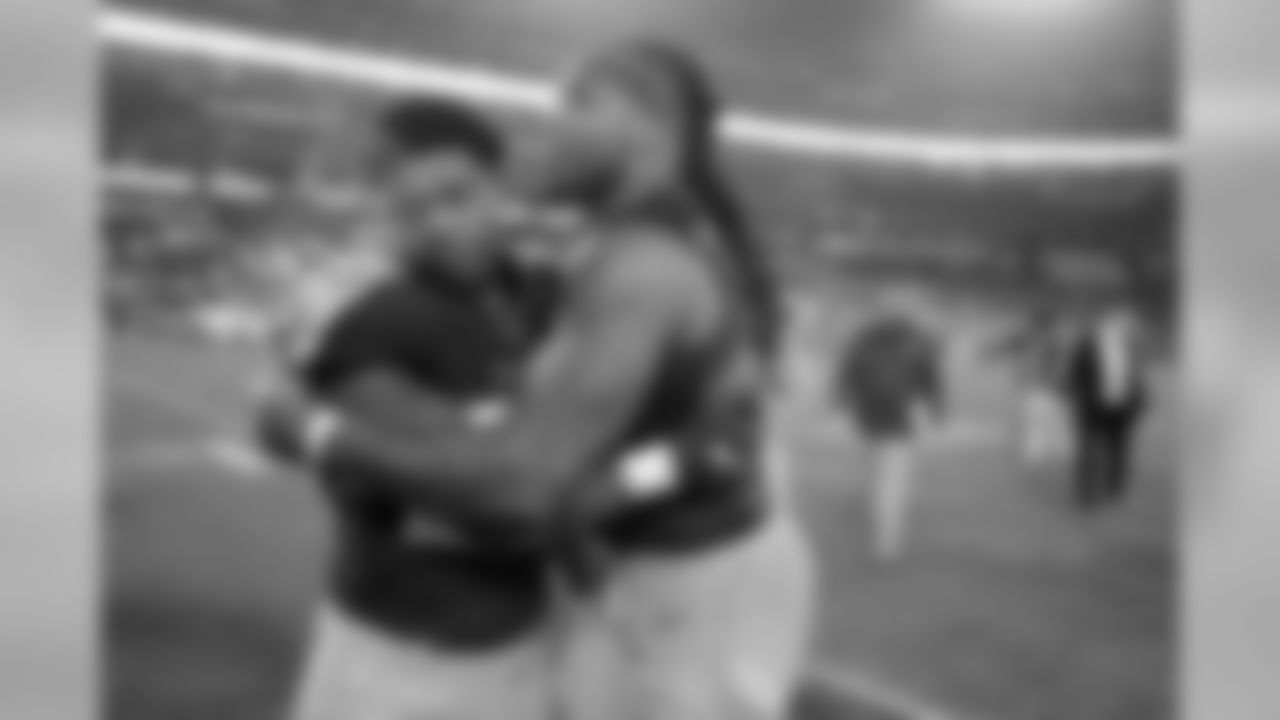 Tennessee Titans inside linebacker Jayon Brown, left, hugs running back Derrick Henry as they leave the field after an NFL football game against the Indianapolis Colts Sunday, Dec. 30, 2018, in Nashville, Tenn. The Colts won 33-17.(AP Photo/James Kenney)